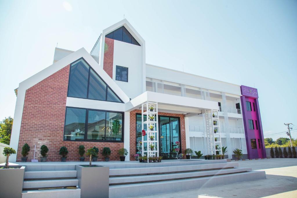 a rendering of a building with steps in front at Khun Ying Hotel in Nan