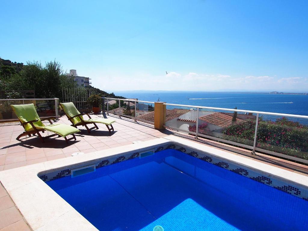 a swimming pool on a balcony with a view of the ocean at Holiday Home Mila i Fontanals by Interhome in Roses
