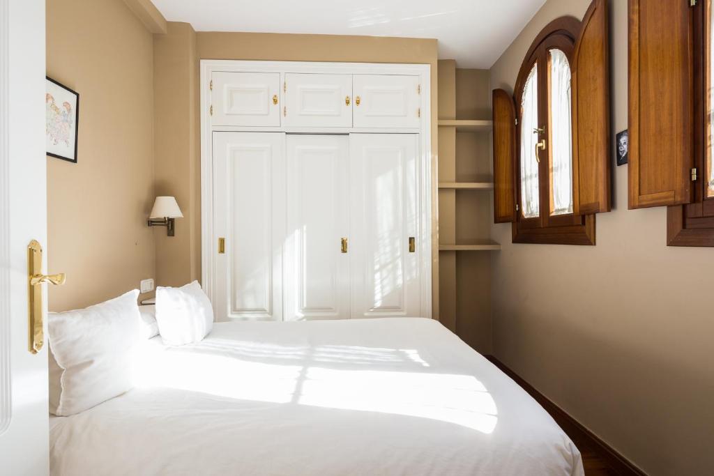 Łóżko lub łóżka w pokoju w obiekcie Veoapartment Casa Catedral