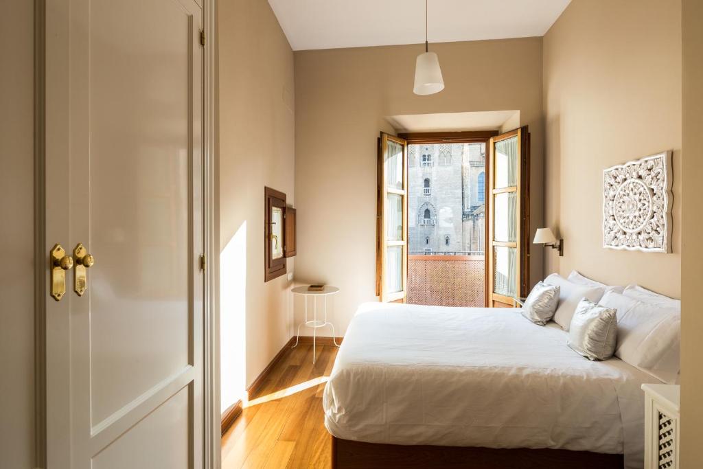 Łóżko lub łóżka w pokoju w obiekcie Veoapartment Casa Catedral