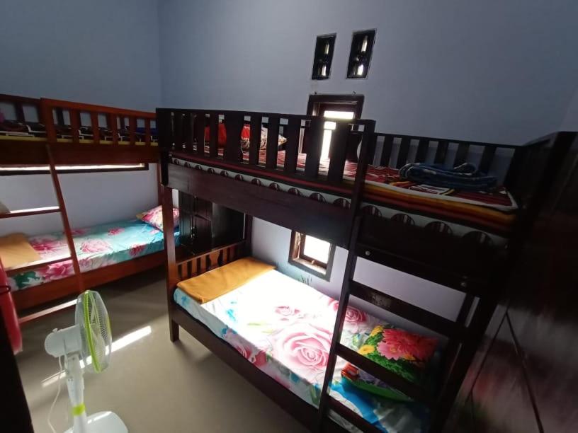 Postel nebo postele na pokoji v ubytování D'corner Homestay