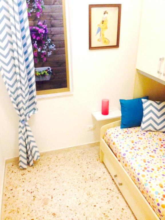 A bed or beds in a room at Bright Apartment in Alcamo: 100 m² with Sea View