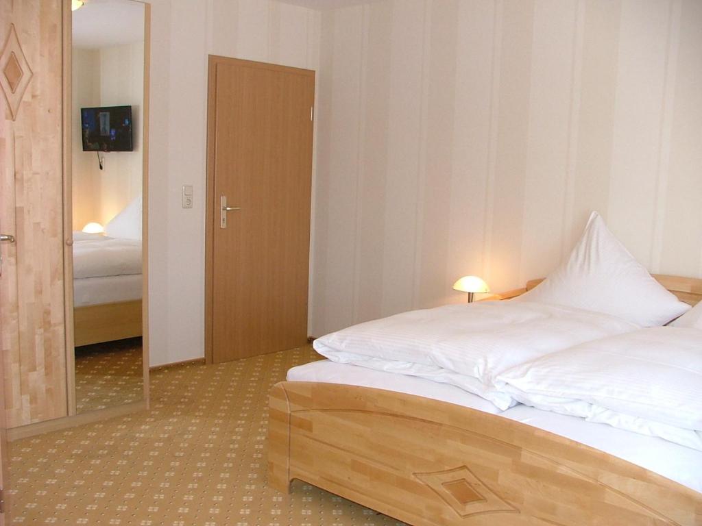 Postel nebo postele na pokoji v ubytování Hotel Thule