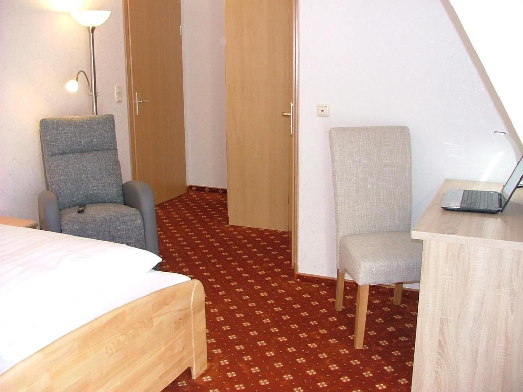 Postel nebo postele na pokoji v ubytování Hotel Thule