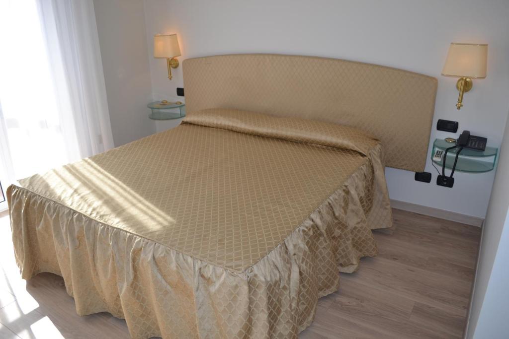 Postel nebo postele na pokoji v ubytování Hotel Il Gatto
