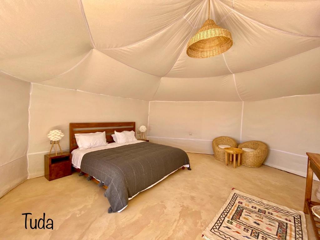 Postel nebo postele na pokoji v ubytování Tuda Luxury Camp