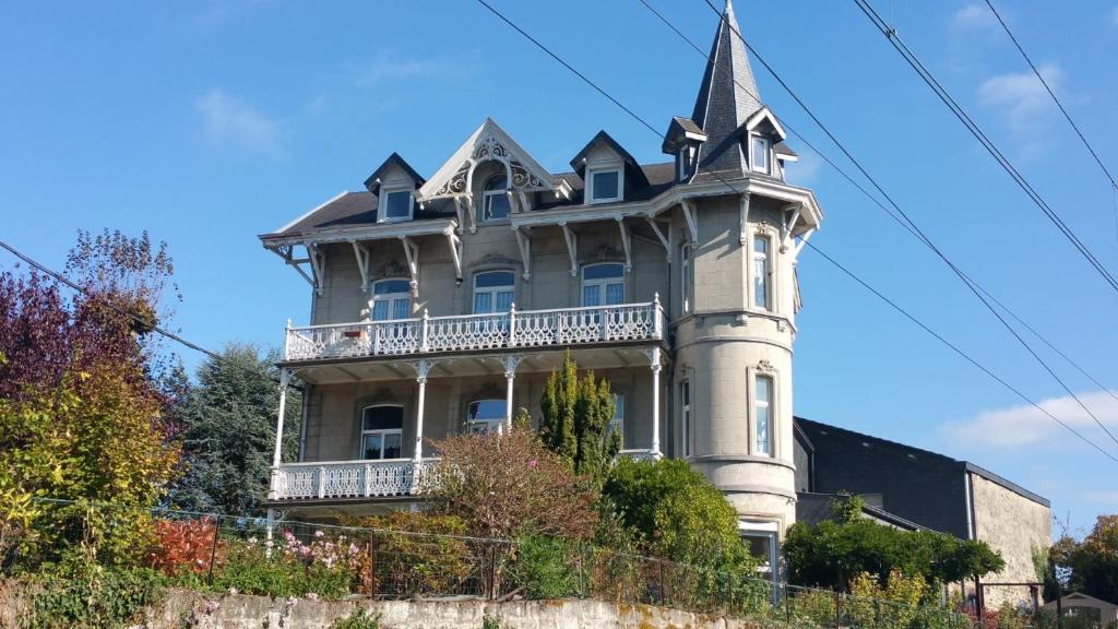 a large house with a turret on top of it at Studio Terrasse Spa in Spa