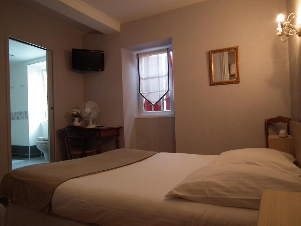 Postel nebo postele na pokoji v ubytování hôtel Piellenia