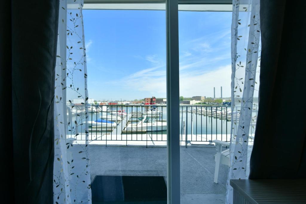 an open window with a view of a harbor at The Freeport Inn and Marina in Freeport