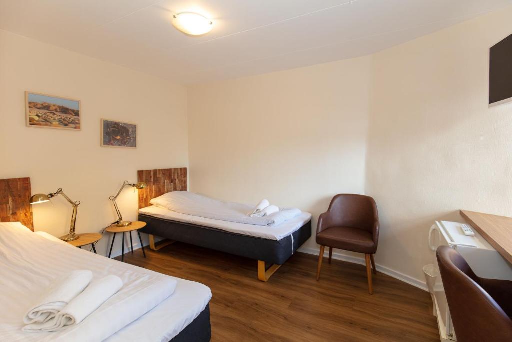 Posteľ alebo postele v izbe v ubytovaní Foldens Hotel