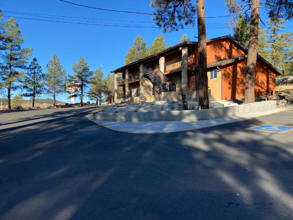 a house on the side of a road with at Motel In The Pines in Munds Park