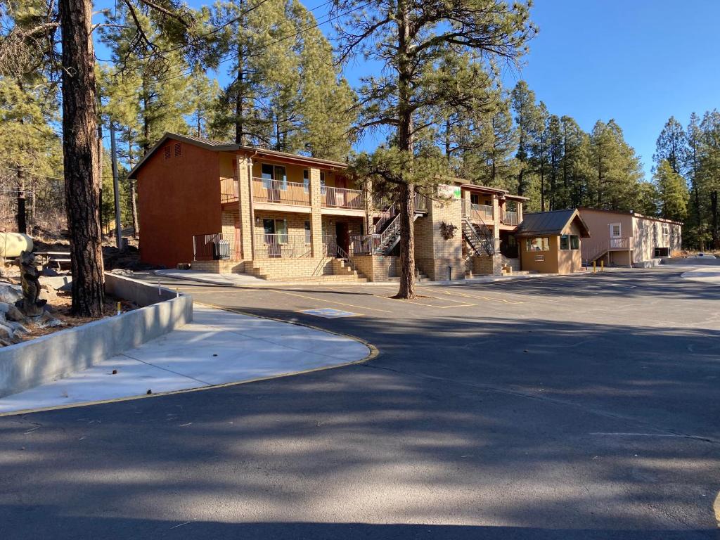 a house on the side of a road at Motel In The Pines in Munds Park