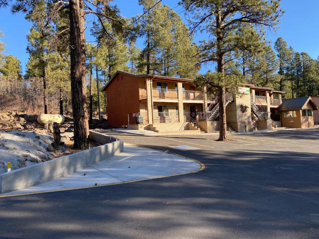 a house on the side of a road at Motel In The Pines in Munds Park