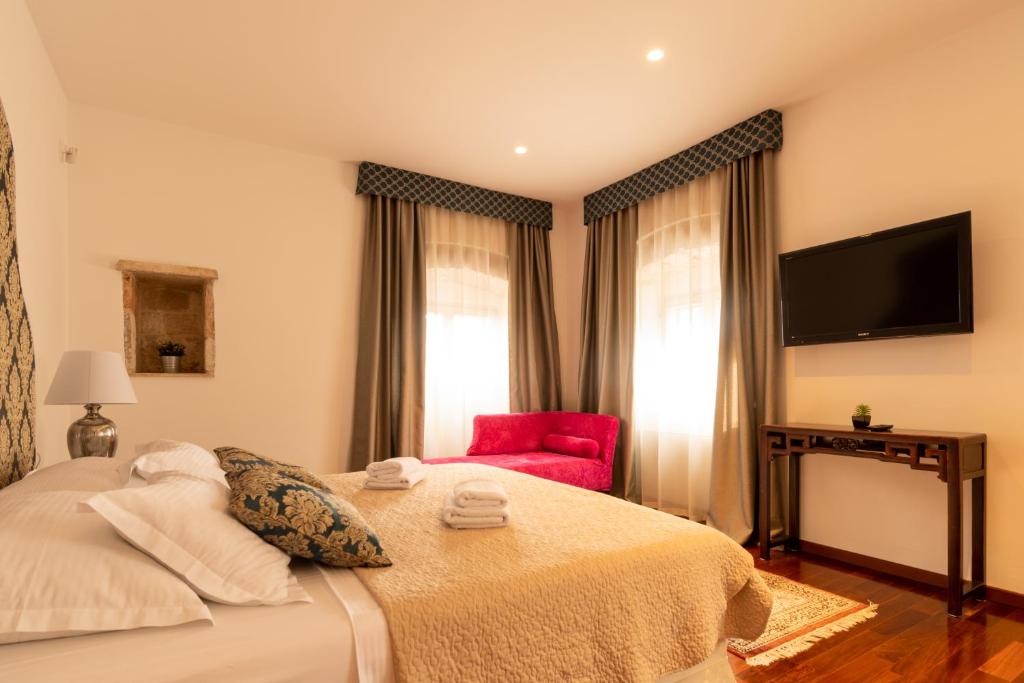 Posteľ alebo postele v izbe v ubytovaní B&B Heritage Villa Apolon