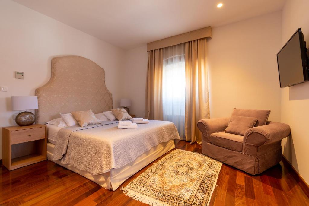 Posteľ alebo postele v izbe v ubytovaní B&B Heritage Villa Apolon