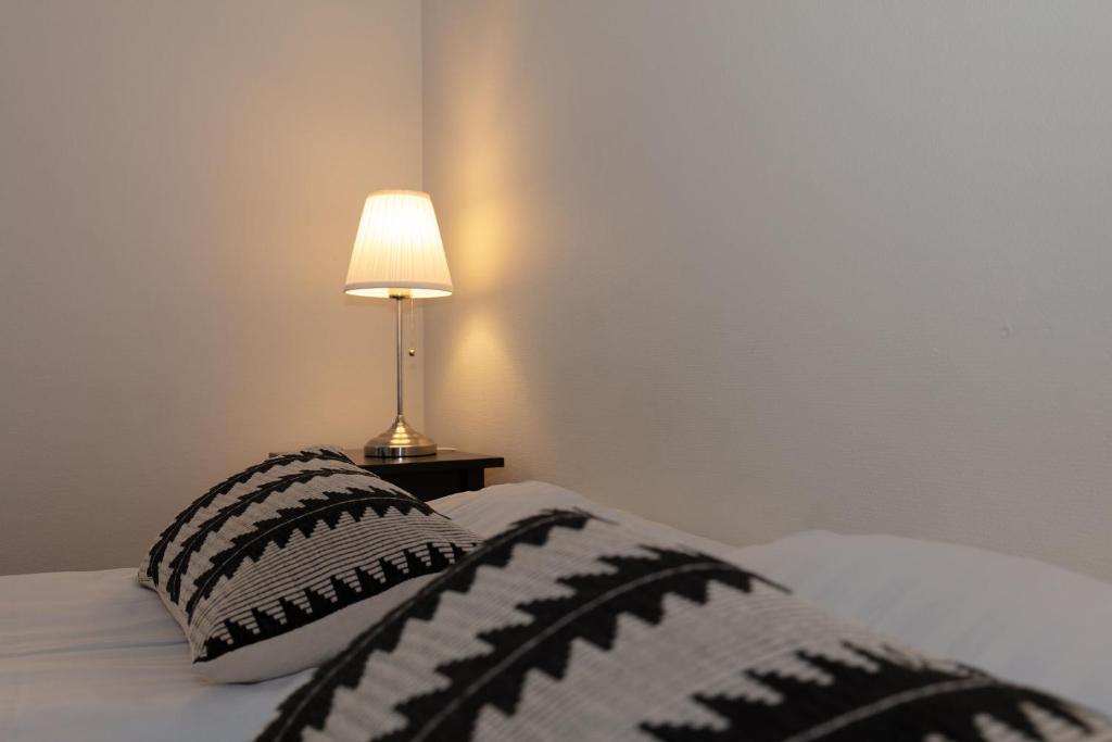 Postel nebo postele na pokoji v ubytování Skagen Hotel Annex