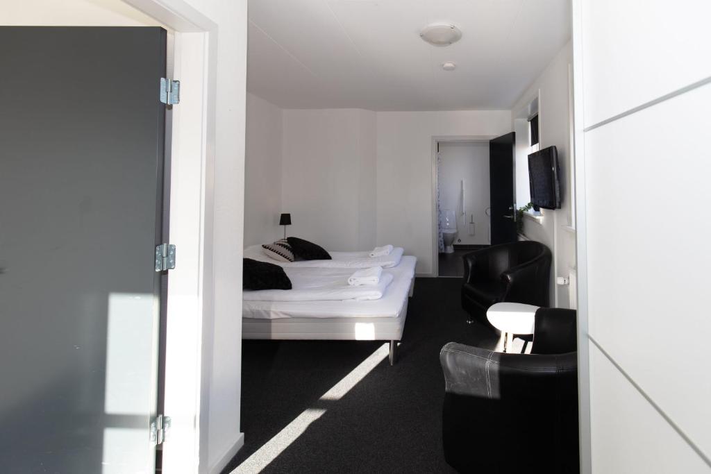 Postel nebo postele na pokoji v ubytování Skagen Hotel Annex