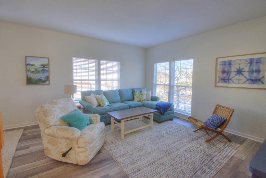 a living room with a couch and a chair at 34 Pier Point Dr, Millville in Millville