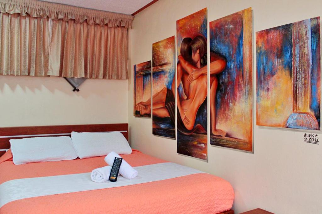Postel nebo postele na pokoji v ubytování Hostal Dulce Amanecer