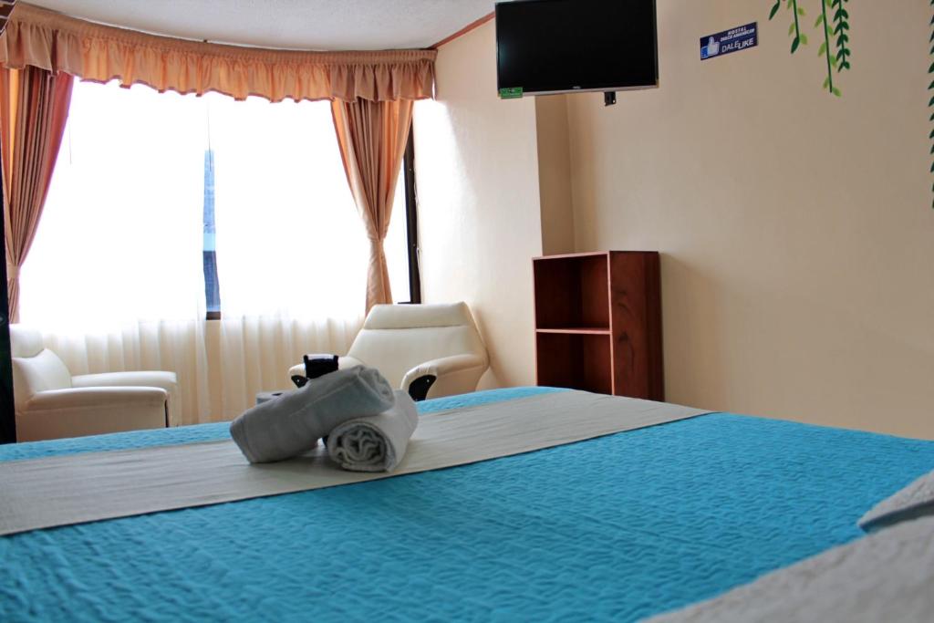 Postel nebo postele na pokoji v ubytování Hostal Dulce Amanecer