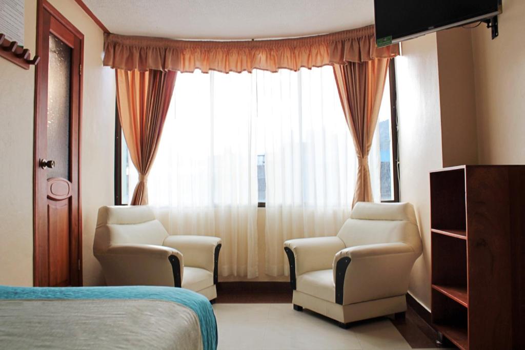 Postel nebo postele na pokoji v ubytování Hostal Dulce Amanecer