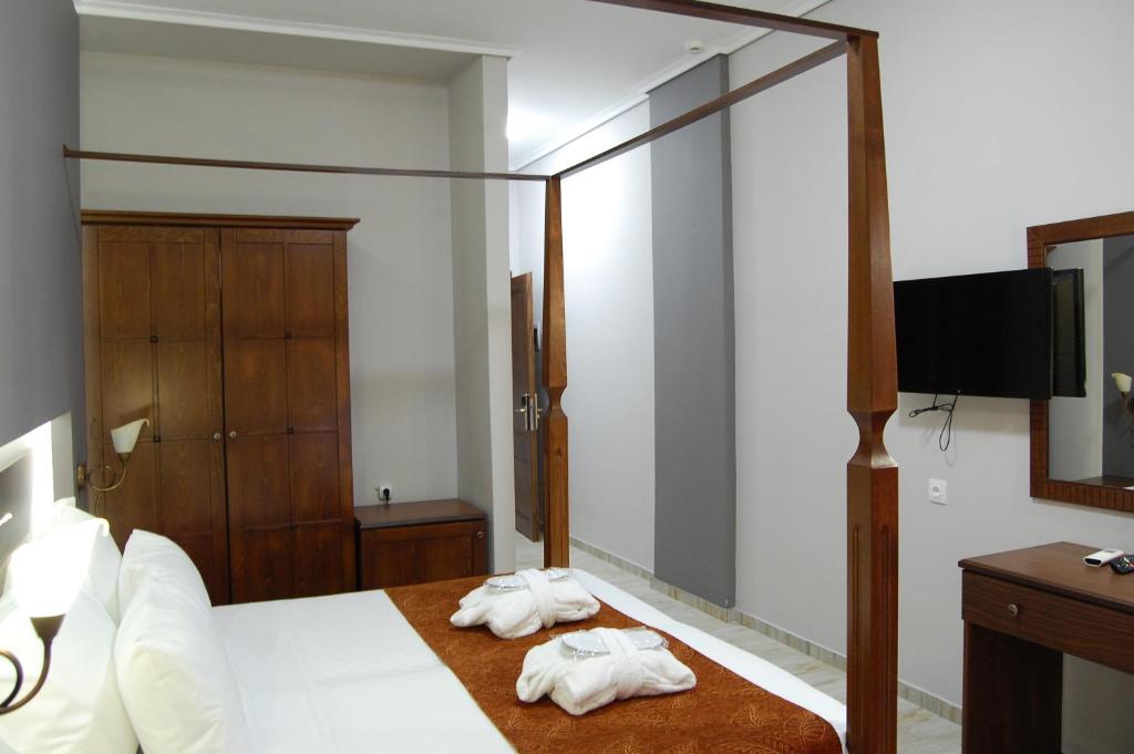 Postel nebo postele na pokoji v ubytování Paralia Beach Boutique Hotel