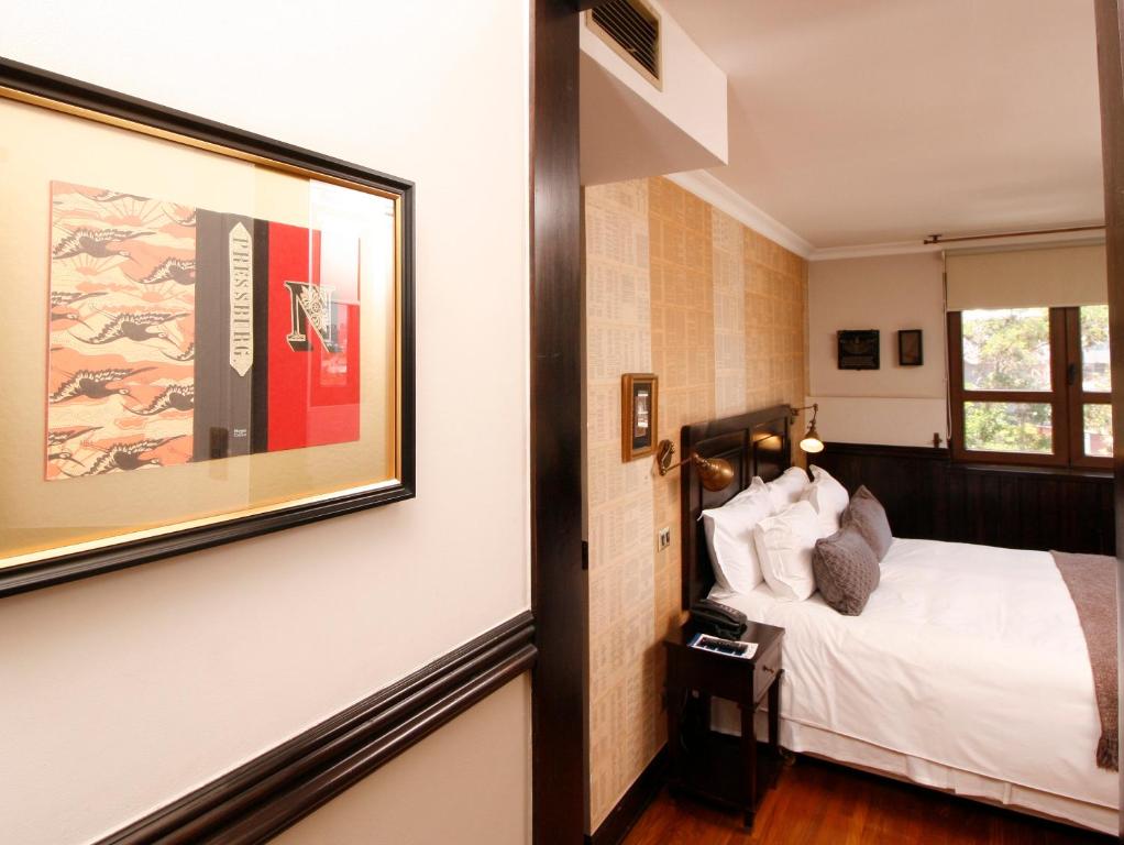 Postel nebo postele na pokoji v ubytování Hotel Boutique Castillo Rojo