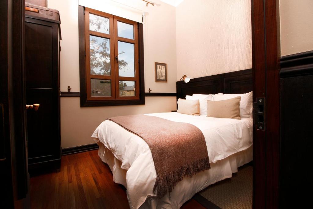 Postel nebo postele na pokoji v ubytování Hotel Boutique Castillo Rojo