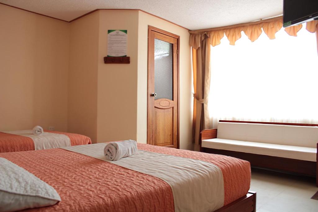 Postel nebo postele na pokoji v ubytování Hostal Dulce Amanecer