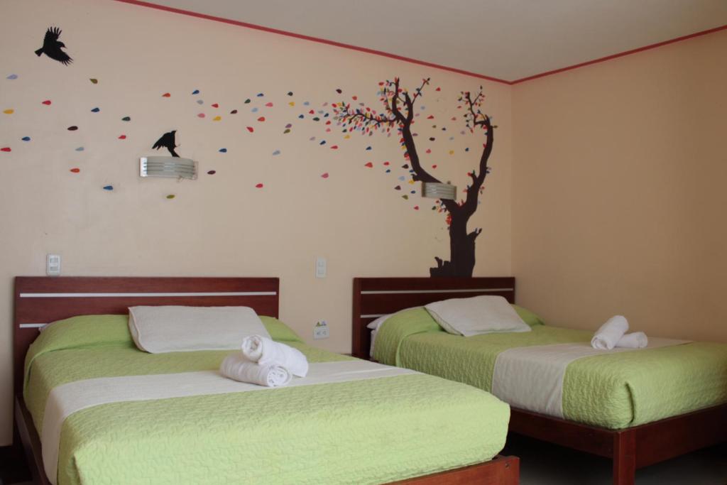 Postel nebo postele na pokoji v ubytování Hostal Dulce Amanecer