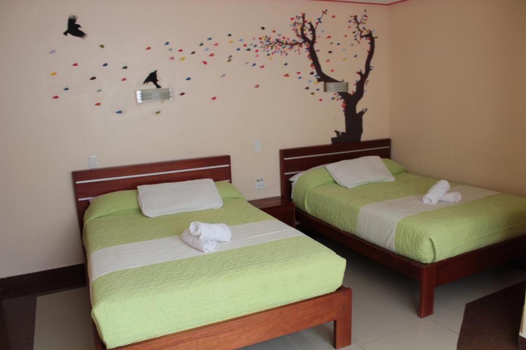Postel nebo postele na pokoji v ubytování Hostal Dulce Amanecer