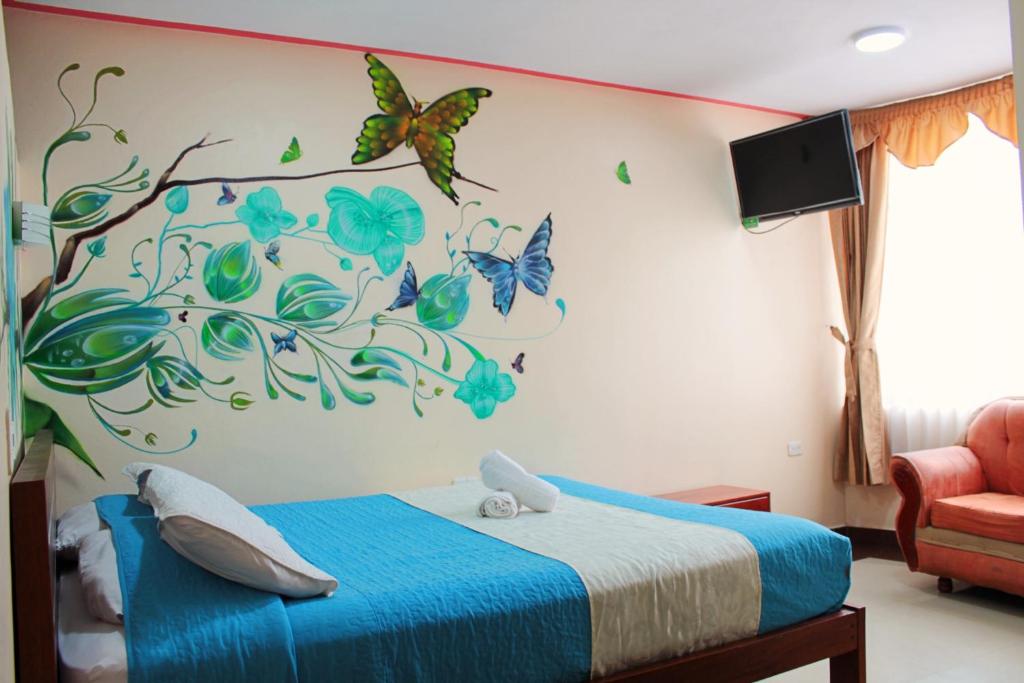 Postel nebo postele na pokoji v ubytování Hostal Dulce Amanecer