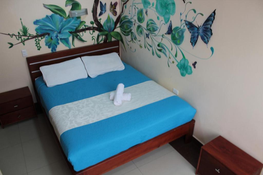 Postel nebo postele na pokoji v ubytování Hostal Dulce Amanecer