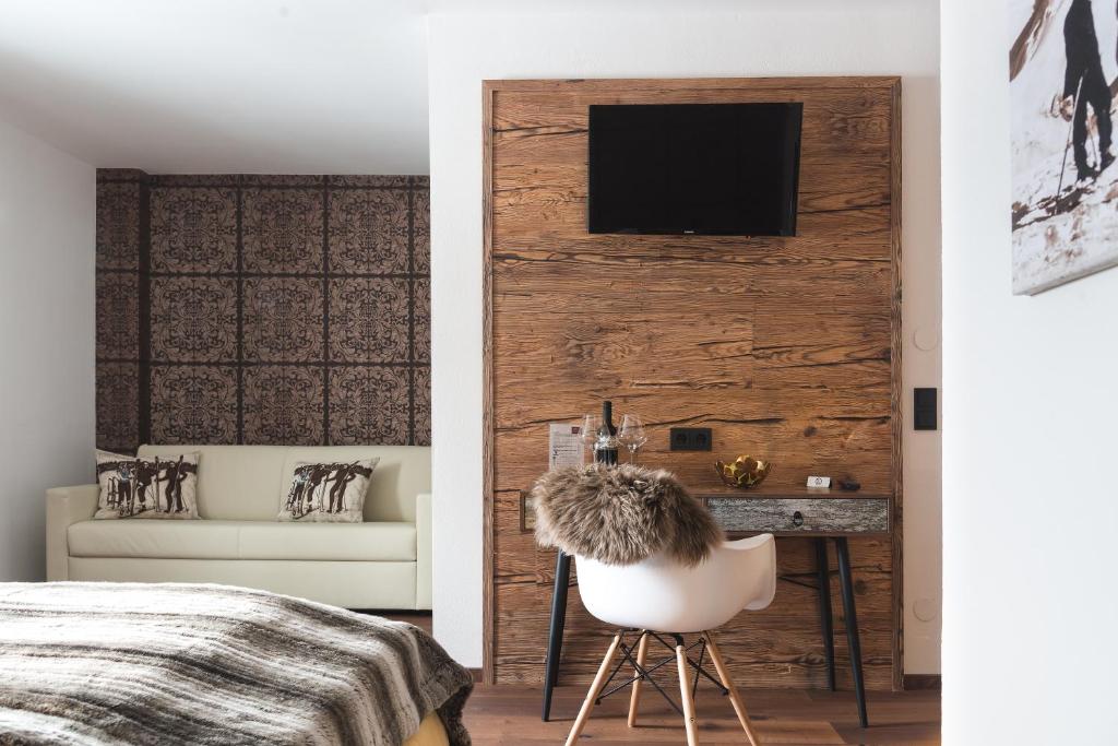 TV a/nebo společenská místnost v ubytování Boutique Hotel ANYBODY
