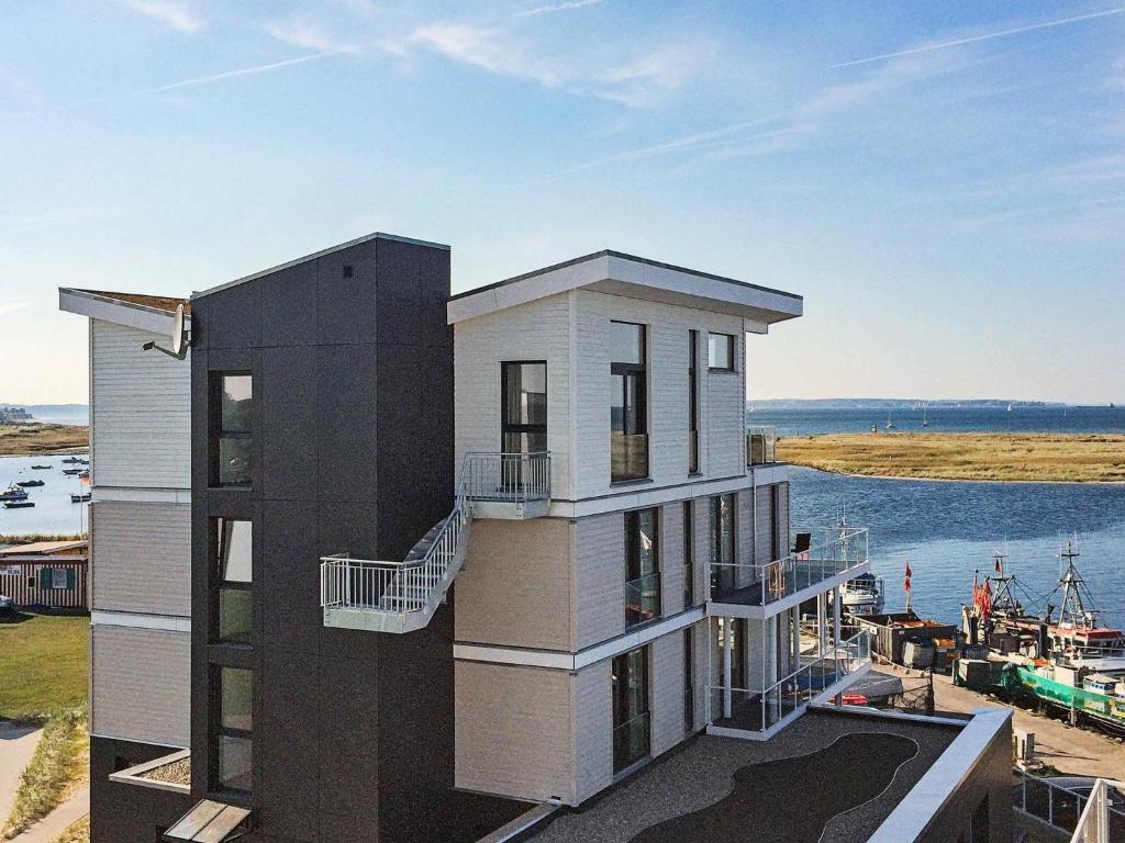 a building with a view of a marina at One-Bedroom Holiday home in Wendtorf 10 in Wendtorf