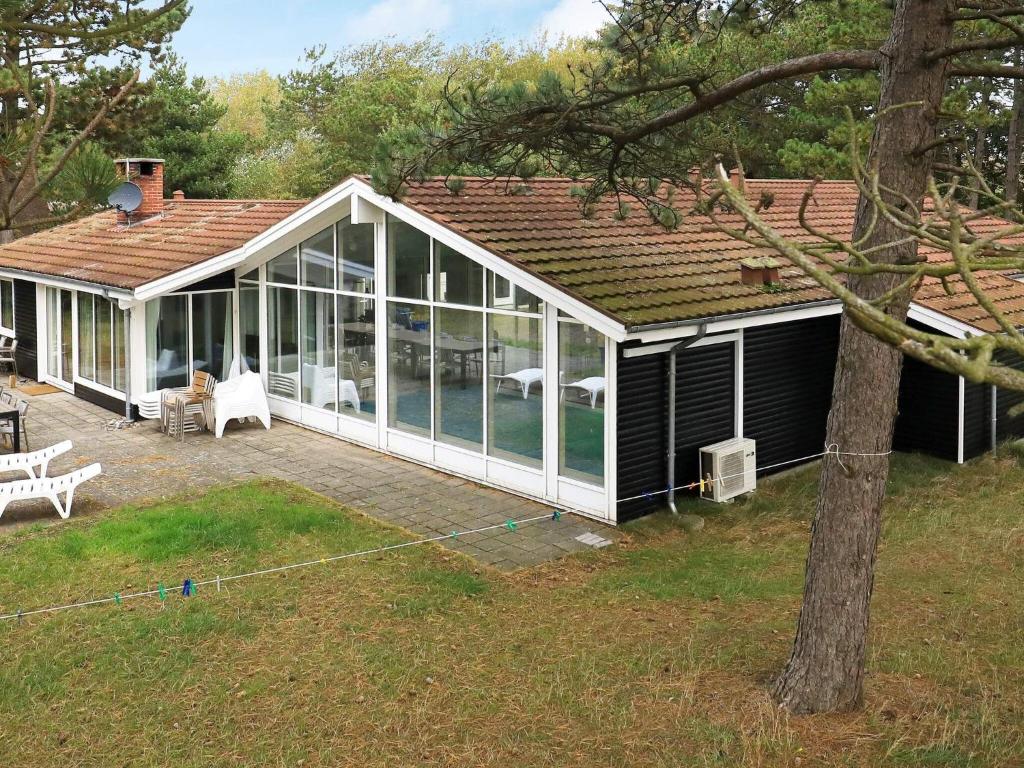 a screened in porch of a house with a yard at Six-Bedroom Holiday home in Humble in Humble