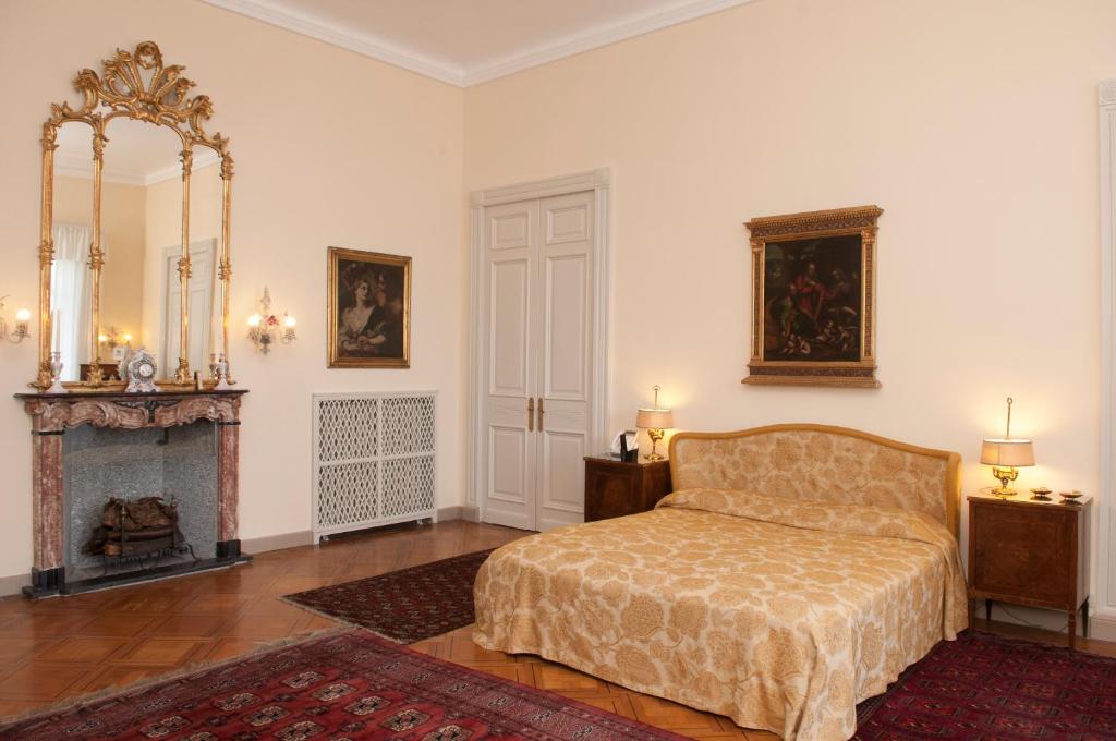 Postel nebo postele na pokoji v ubytování Villa Claudia dei Marchesi Dal Pozzo