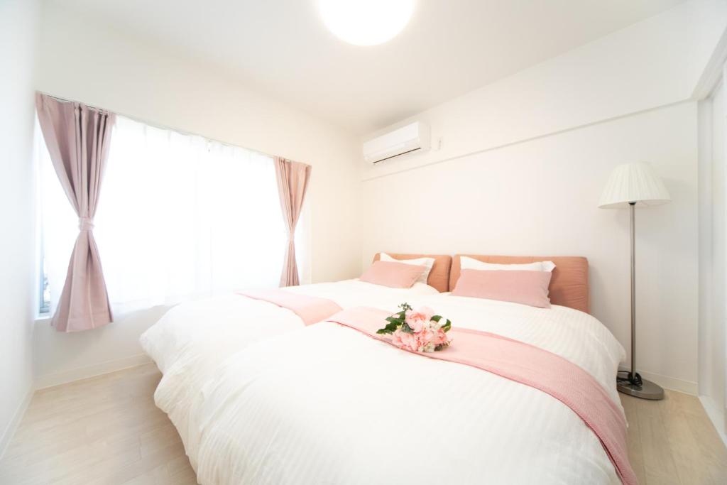 Postel nebo postele na pokoji v ubytování Awaji Central Villa in Shizuki1764