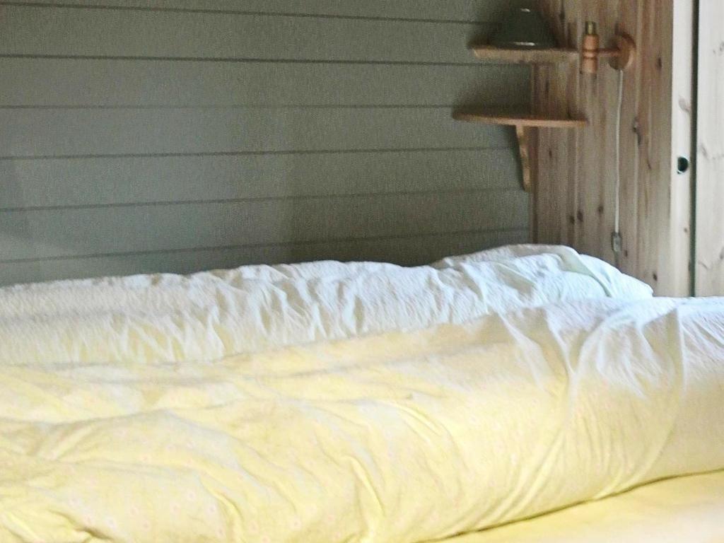 Postel nebo postele na pokoji v ubytování 11 person holiday home in Edland