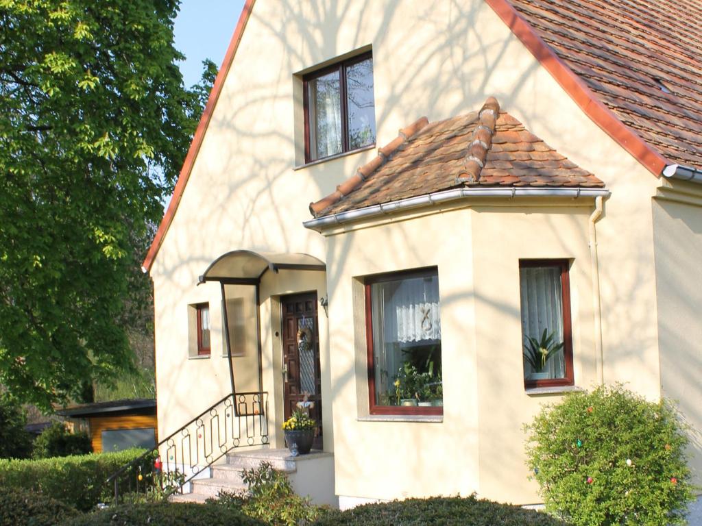 a white house with a brown roof at Cozy Apartment with Garden Barbecue Bicycle Storage in Neubukow