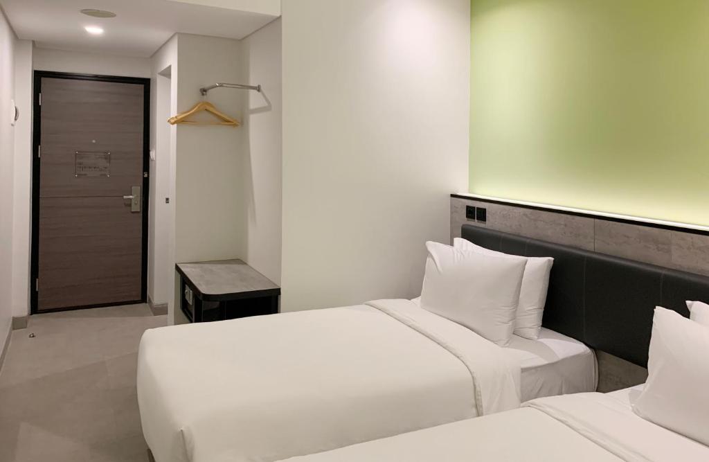Voodi või voodid majutusasutuse Amaris Hotel Tasikmalaya toas