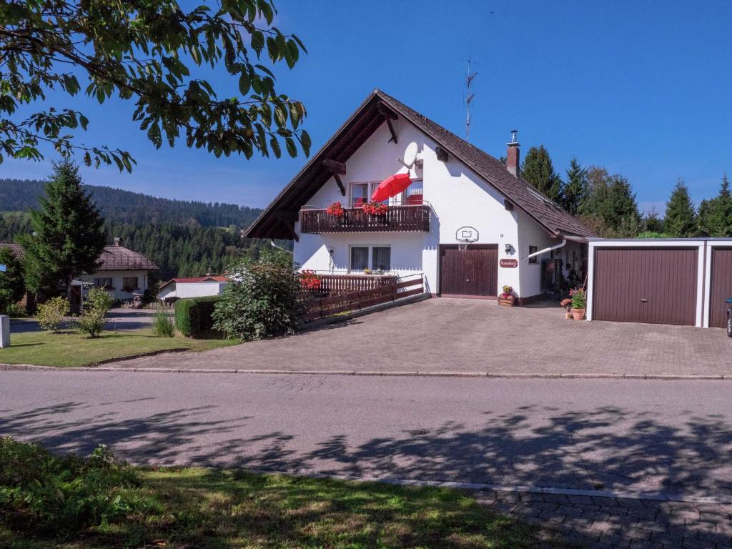 a large white house with a large driveway at Flat in Herrischried Black Forest in Herrischried
