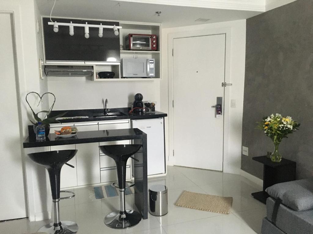 Kuchyň nebo kuchyňský kout v ubytování Loft Confortável e Moderno