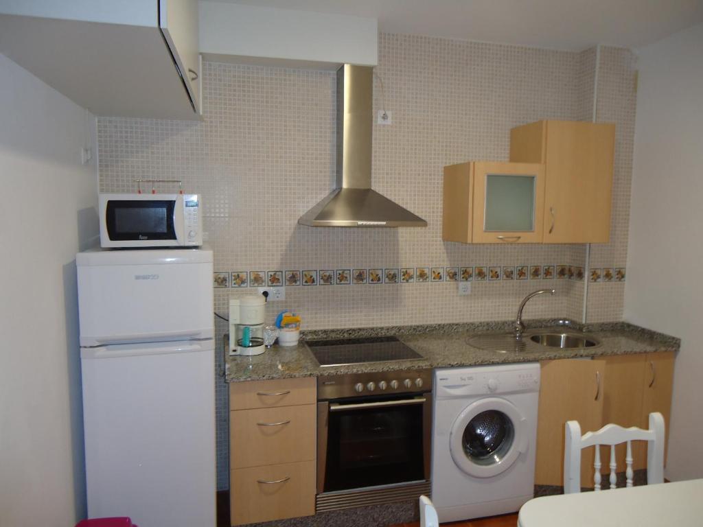 A kitchen or kitchenette at Apartamentos San Guillermo