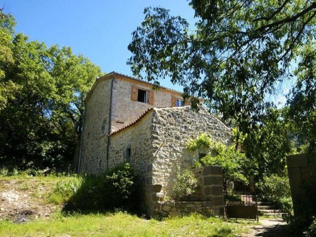 an old stone building sitting in a field at Holiday Home in a Nature Reserve in Beaulieu in Beaulieu