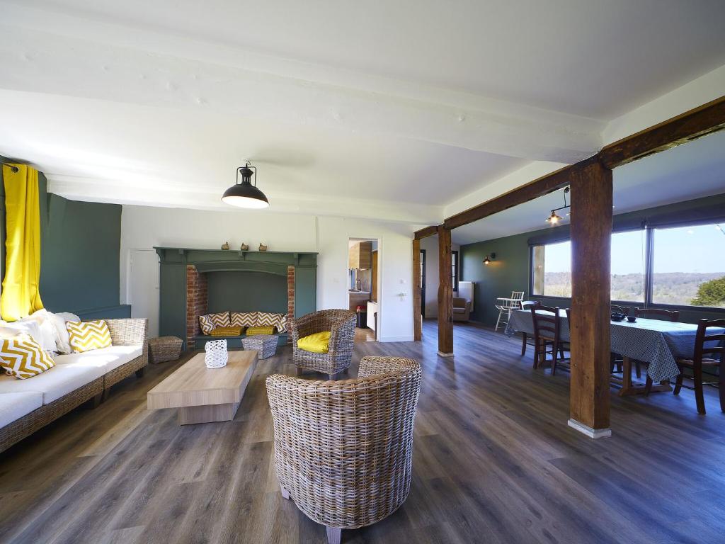 a living room with a couch and a pool table at Castle and its outbuildings with terrace in Asni res in Asnières