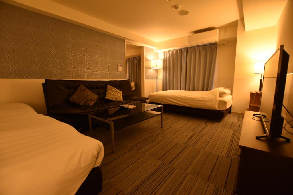 Postel nebo postele na pokoji v ubytování Residence Condominium KALAHAAI