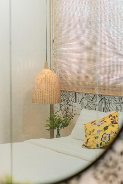 Postel nebo postele na pokoji v ubytování Shoho Hotel Nha Trang