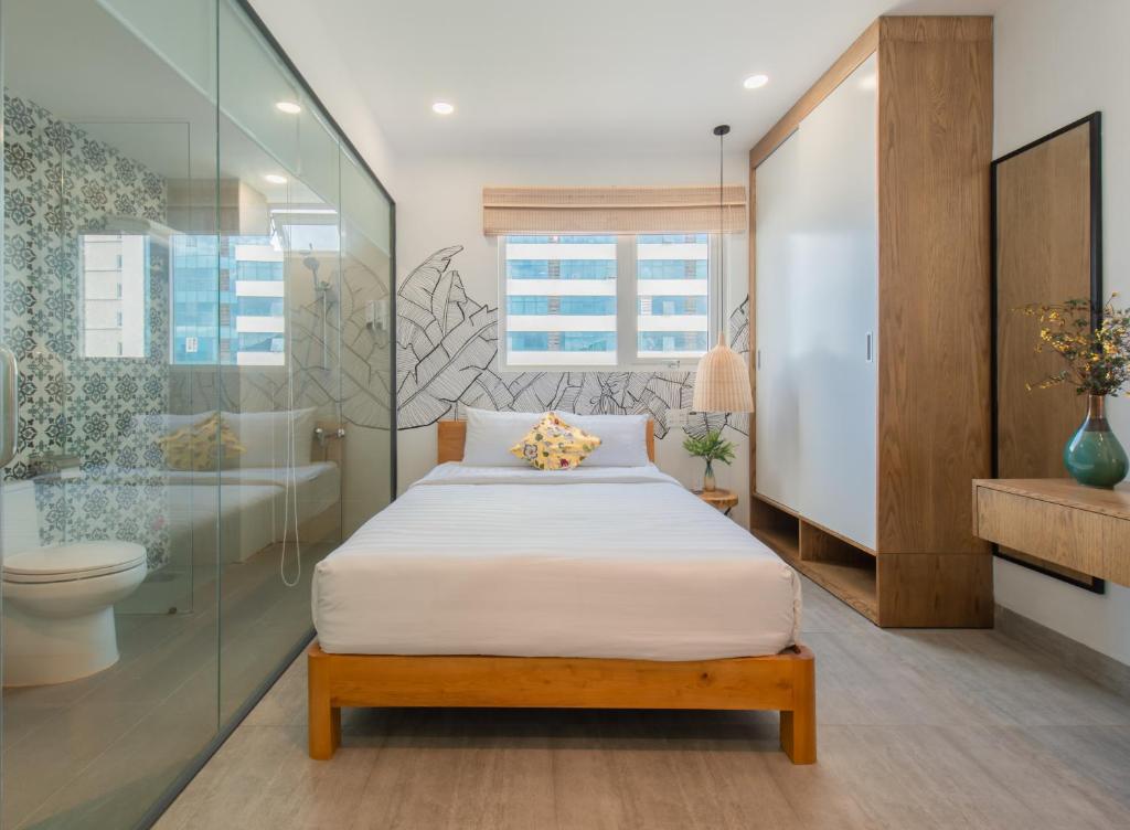 Postel nebo postele na pokoji v ubytování Shoho Hotel Nha Trang