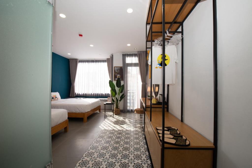 Postel nebo postele na pokoji v ubytování Shoho Hotel Nha Trang